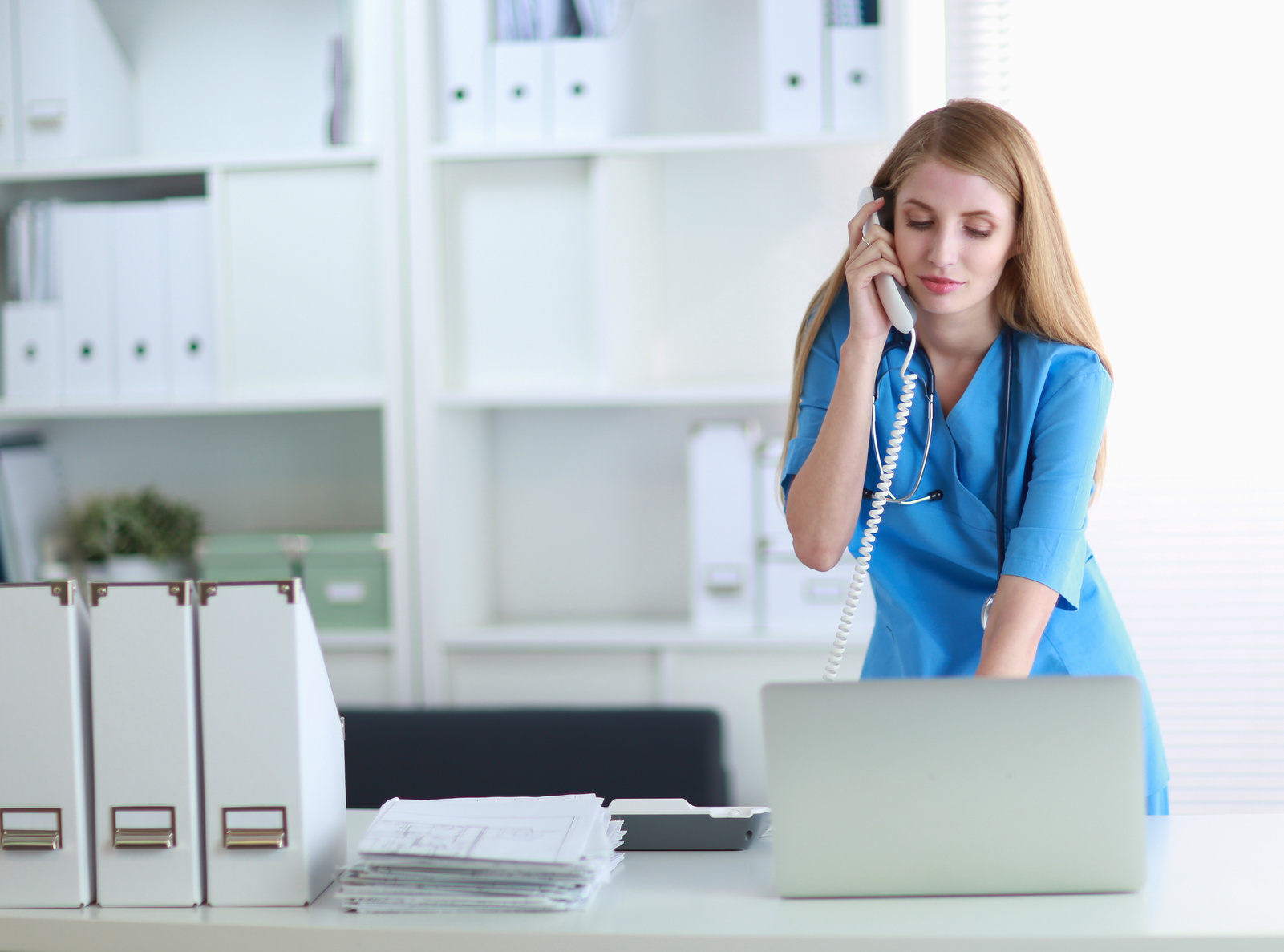 doctor on phone with patient