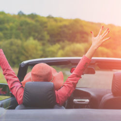 Summer road trip with urinary incontinence | CU Urogynecology | Woman in convertible